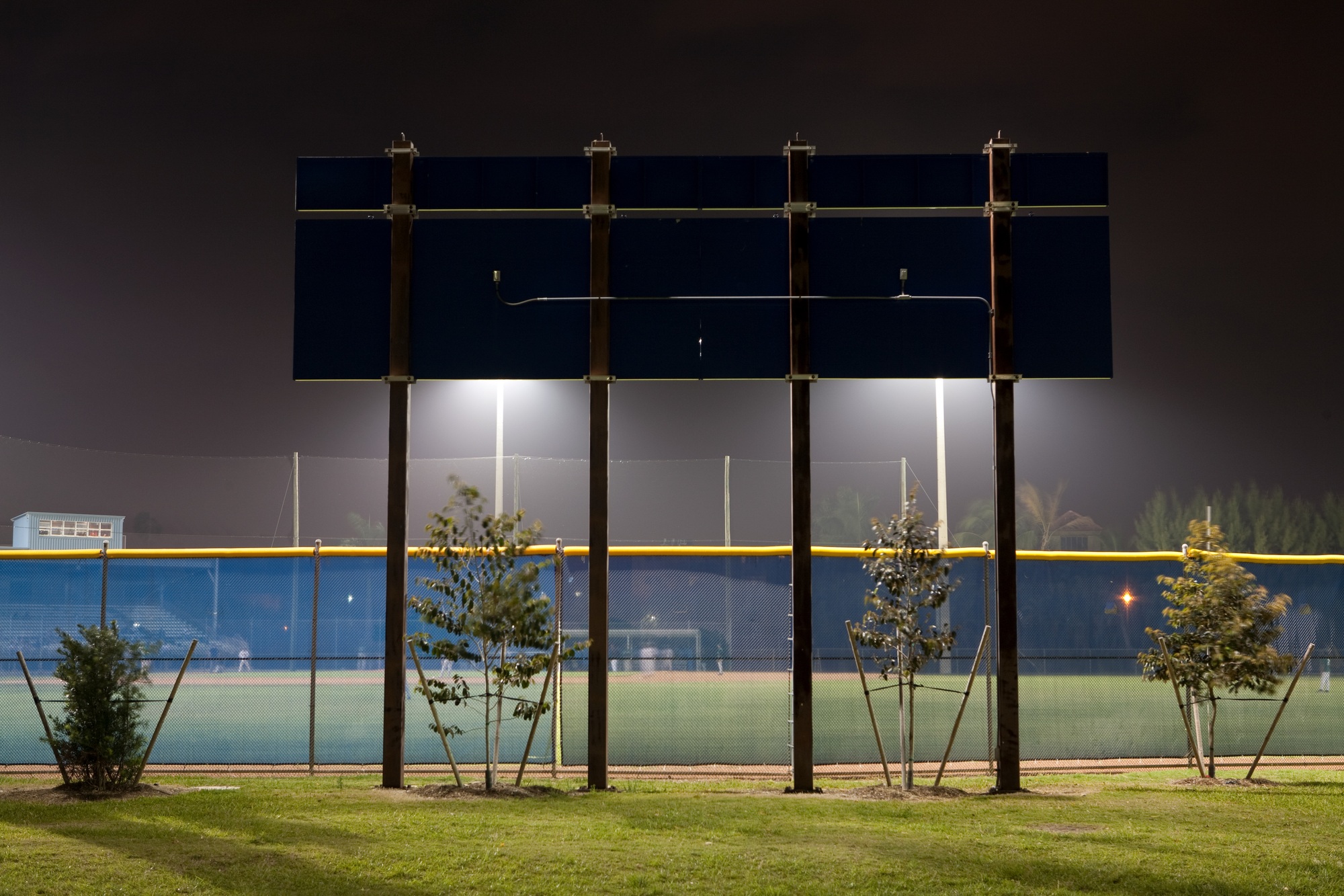 Stadium scoreboard illuminated sportsground at night